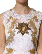 Elfenbeinfarbenes, ärmelloses Seidenkleid mit Spitze und Verzierungen