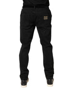 Schwarze, zerfetzte, schmal geschnittene Jeans aus Baumwoll-Denim