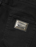 Schwarze, zerfetzte, schmal geschnittene Jeans aus Baumwoll-Denim