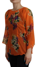 Orange Bluse mit langen Ärmeln und Blumenmuster