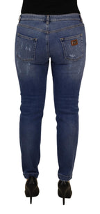 Jeans in denim di cotone délavé blu a vita bassa e gamba aderente