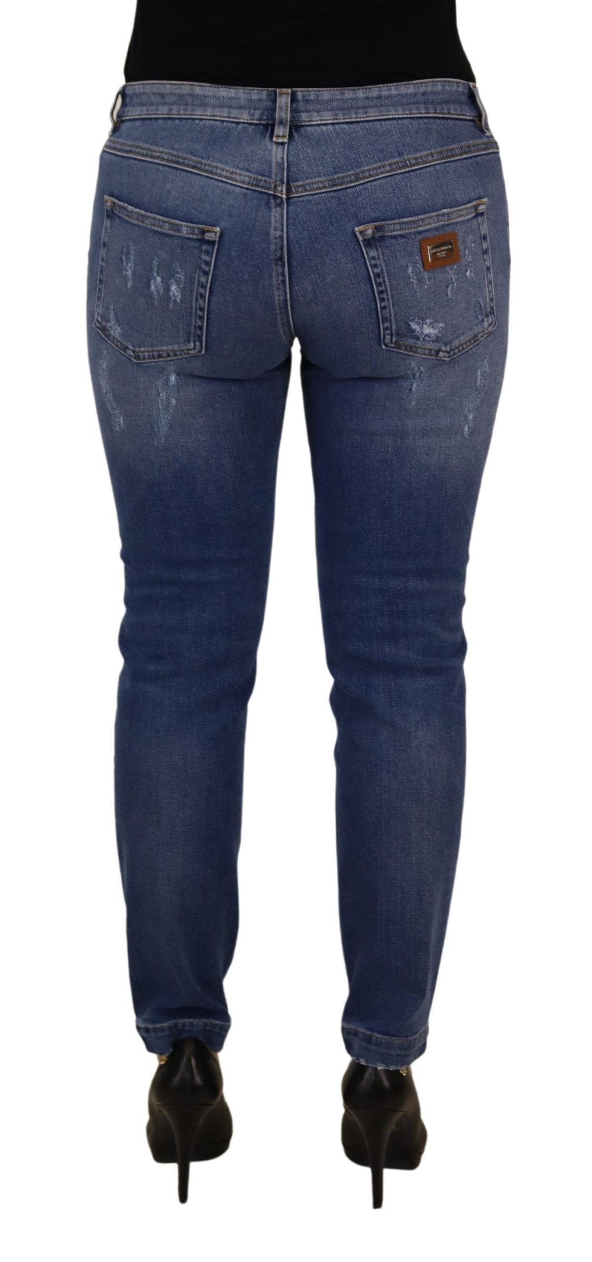 Jeans in denim di cotone délavé blu a vita bassa e gamba aderente