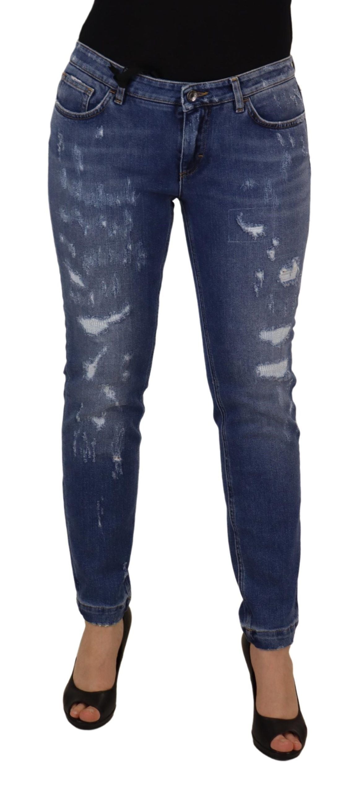 Jeans in denim di cotone délavé blu a vita bassa e gamba aderente