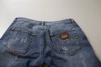 Jeans in denim di cotone délavé blu a vita bassa e gamba aderente