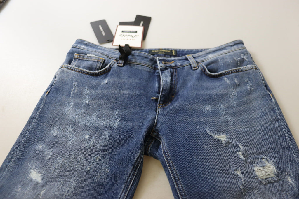 Jeans in denim di cotone délavé blu a vita bassa e gamba aderente