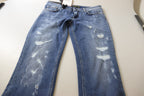 Jeans in denim di cotone délavé blu a vita bassa e gamba aderente