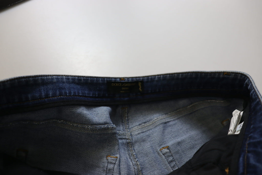 Jeans in denim di cotone délavé blu a vita bassa e gamba aderente