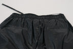 Schwarze, glänzende Nylonhose mit Kordelzug