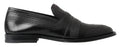 Schwarze Slipper aus Leder mit Ziernähten