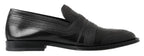 Schwarze Slipper aus Leder mit Ziernähten
