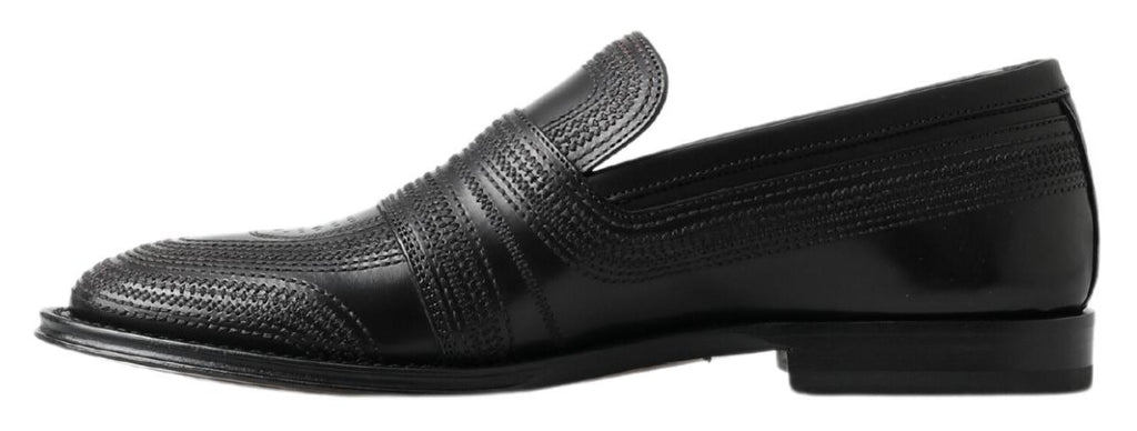 Schwarze Slipper aus Leder mit Ziernähten