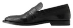 Schwarze Slipper aus Leder mit Ziernähten