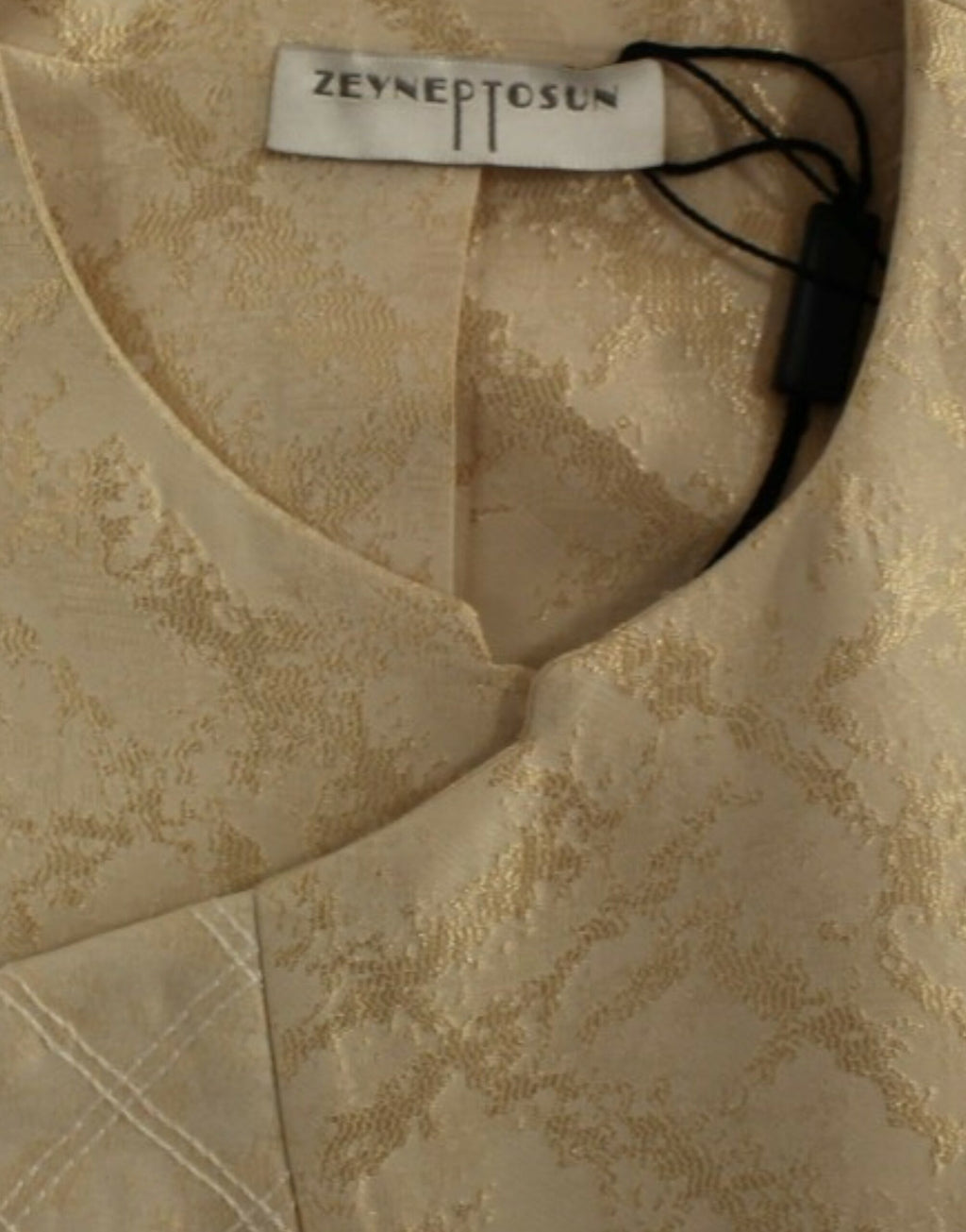 Ärmellose Jacke aus beigem Brokat