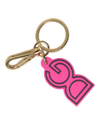 Pinker Schlüsselanhänger mit DG-Logo aus Gummi und goldfarbenem Metall