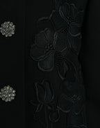Schwarz blumengemusterte Wolljacke mit Knopfverzierungen