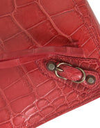 Rote Geldbörse aus exotischem Leder in klassischer Ausführung mit Handschlaufe