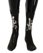 Schwarze elastische Socken mit Blumen und klaren Kristallen