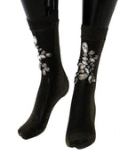 Schwarze elastische Socken mit Blumen und klaren Kristallen