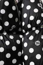 Schwarz-weiße gepunktete Pufferjacke mit durchgehendem Reißverschluss
