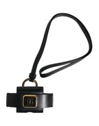 Airpods Hülle aus schwarzem Leder mit goldfarbener Metall-Logo-Plakette