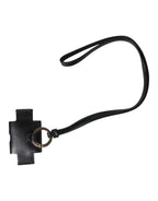 Airpods Hülle aus schwarzem Leder mit goldfarbener Metall-Logo-Plakette