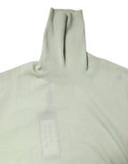 Hellgrüner Rollkragenpullover aus Wolle