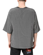 Schwarzes T-Shirt mit grafischem Muster und kurzen Ärmeln