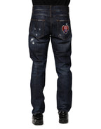 Dunkelblaue zerrissene Röhrenjeans aus Denim