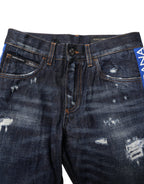 Dunkelblaue zerrissene Röhrenjeans aus Denim