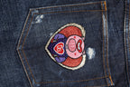 Dunkelblaue zerrissene Röhrenjeans aus Denim