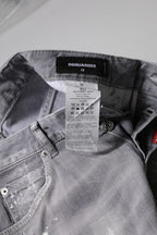 Graue gewaschene Mid-Waist Tapered Jeans
