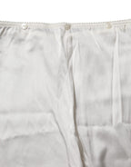 Elfenbeinseidene High-Waist Hose mit schmal zulaufendem Bein