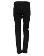 Jeans in denim neri skinny con fodera bianca strappata