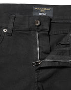 Jeans in denim neri skinny con fodera bianca strappata