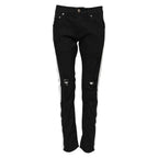 Jeans in denim neri skinny con fodera bianca strappata