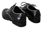 Schwarze Leder-Derbys mit weißer Linie