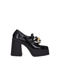 Schwarze Plateau-Slipper aus Leder
