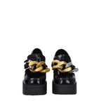Schwarze Plateau-Slipper aus Leder