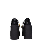 Schwarze Plateau-Slipper aus Leder