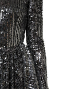 Schwarzes, knielanges A-Linien-Kleid mit langen Ärmeln und Pailletten