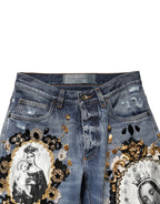 Blaue zerrissene verzierte Baumwoll-Denim-Jeans