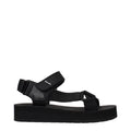 Schwarze flache Sandalen aus Stoff
